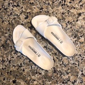 Birkenstock croc material sandals.